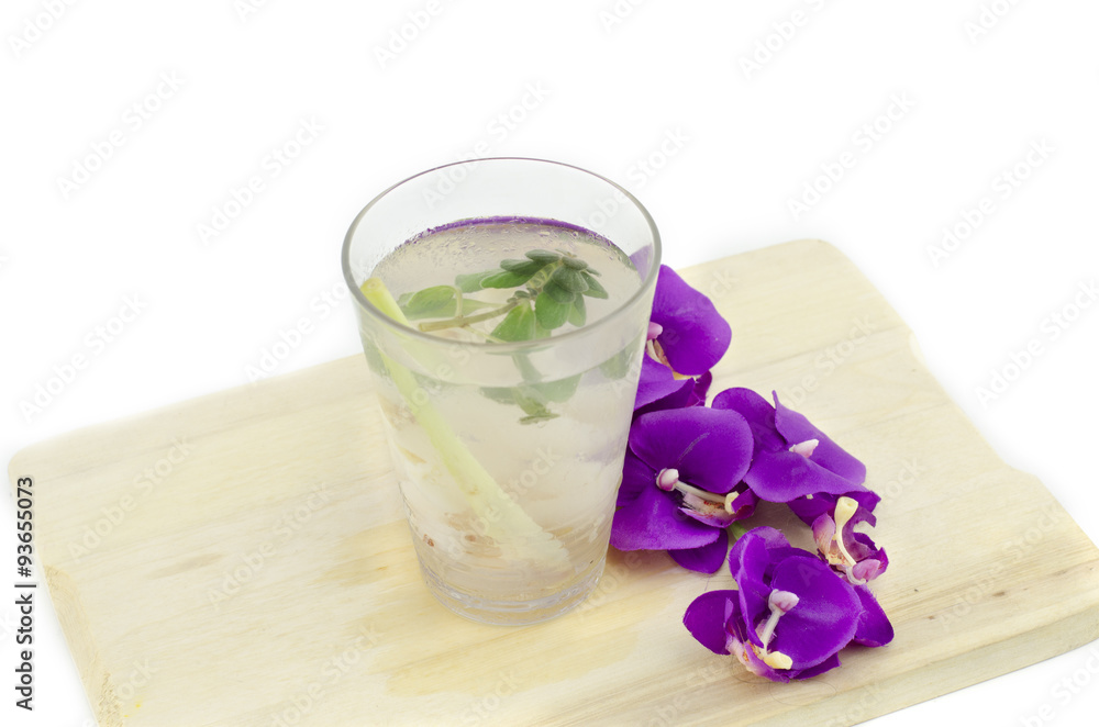 a glass of mix herb drink on wood tray isolated white background a glass of mix herb drink on wood tray isolated white background