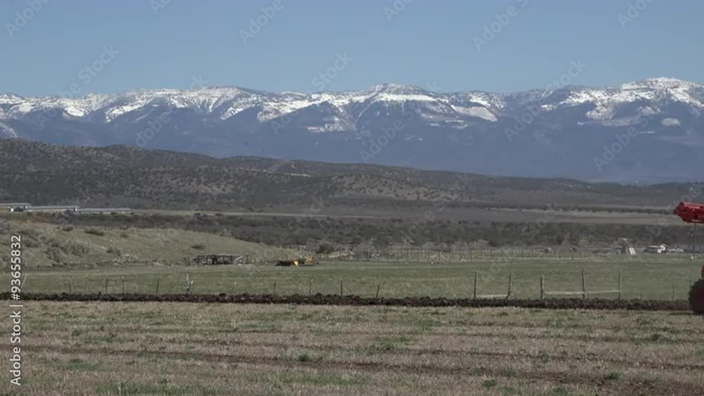 April farmer tractor plow field for spring planting fast 4K 015