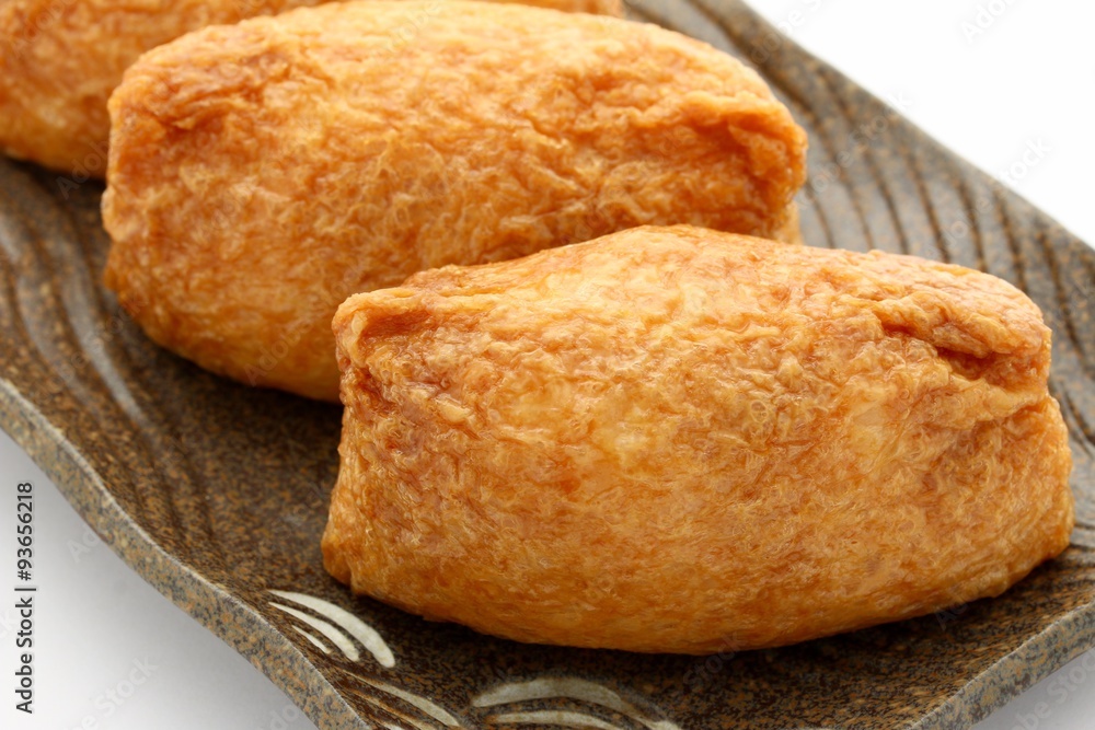 Fototapeta premium Sushi In Fried Tofu On White Background