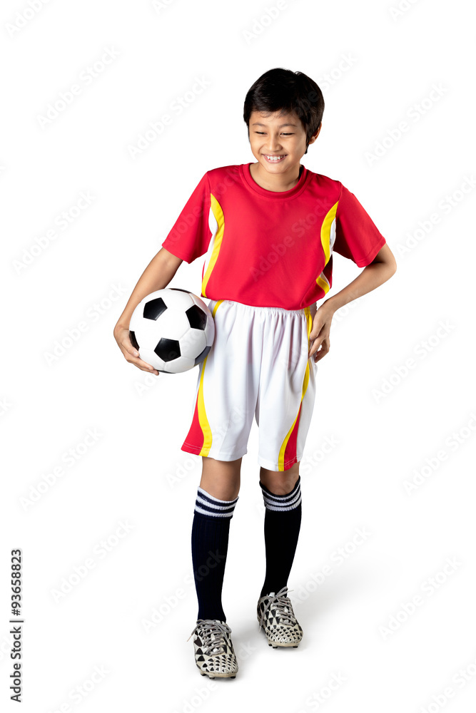 Cute asian boy is holding a soccer ball, Isolated over white