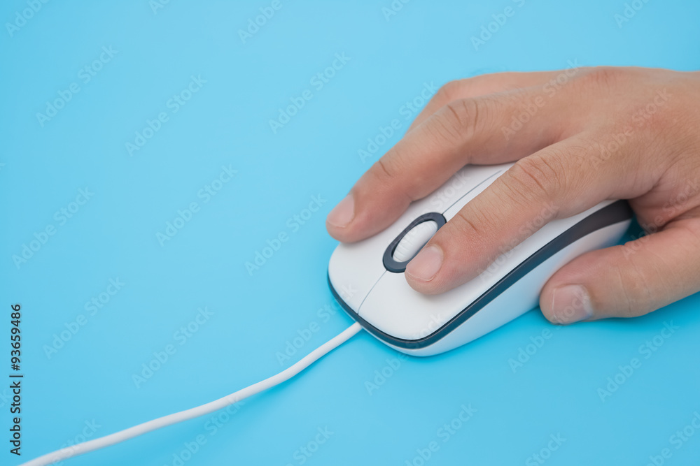 man using a white mouse on a blue background man using a white mouse on a blue background