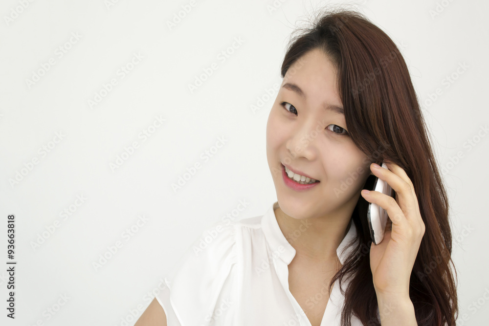 Smiling young asian businesswoman speaking on smart phone Smiling young asian businesswoman speaking on smart phone