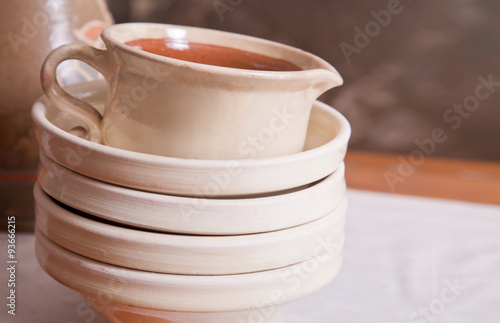 Ceramic plates and a pitcher