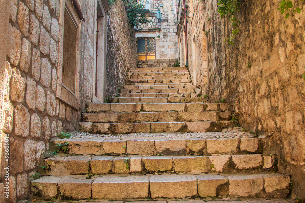 Narrow street and stairs in the Old Town in Dubrovnik, Croatia, Mediterranean ambient Narrow street and stairs in the Old Town in Dubrovnik, Croatia, Mediterranean ambient