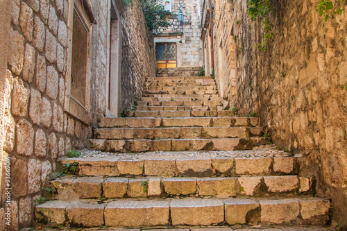 Fototapeta Naklejka Na Ścianę i Meble -   Narrow street and stairs in the Old Town in Dubrovnik, Croatia, Mediterranean ambient