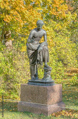 Sculpture in the Catherine Park against the backdrop of autumn trees, Pushkin (Tsarskoe Selo), Russia.