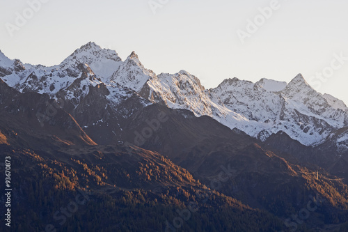 Snow covered mountain peaks in the evening light