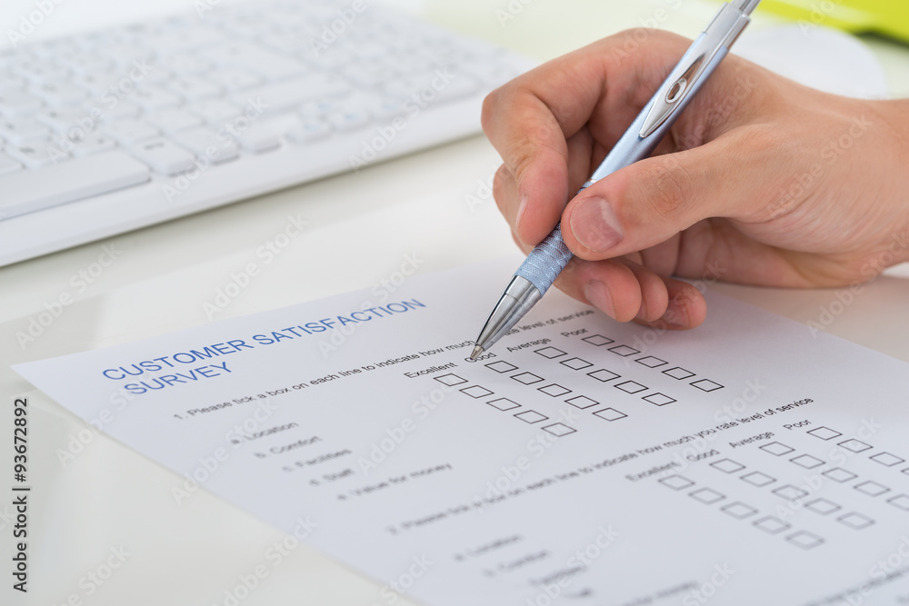 Person Hands Filling Survey Form Person Hands Filling Survey Form