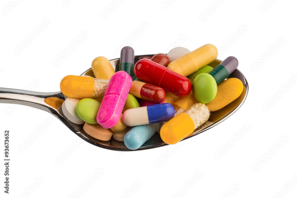 Viele Tabletten auf Löffel Viele Tabletten auf Löffel