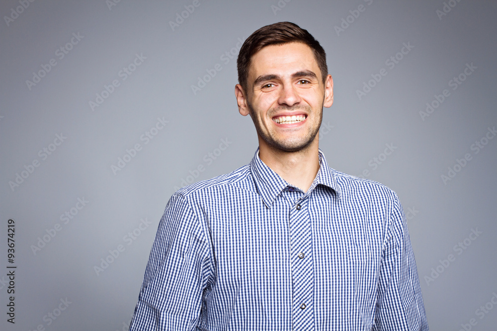 Happy smiling business man, isolated over gray background Happy smiling business man, isolated over gray background