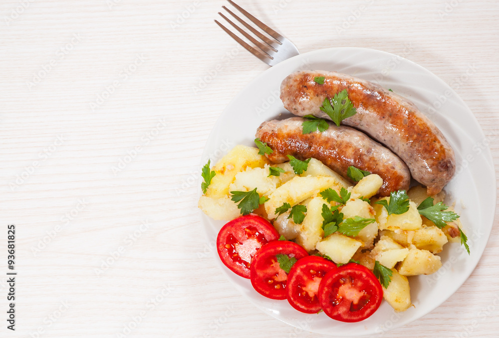 Potatoes with sausages on plate Potatoes with sausages on plate