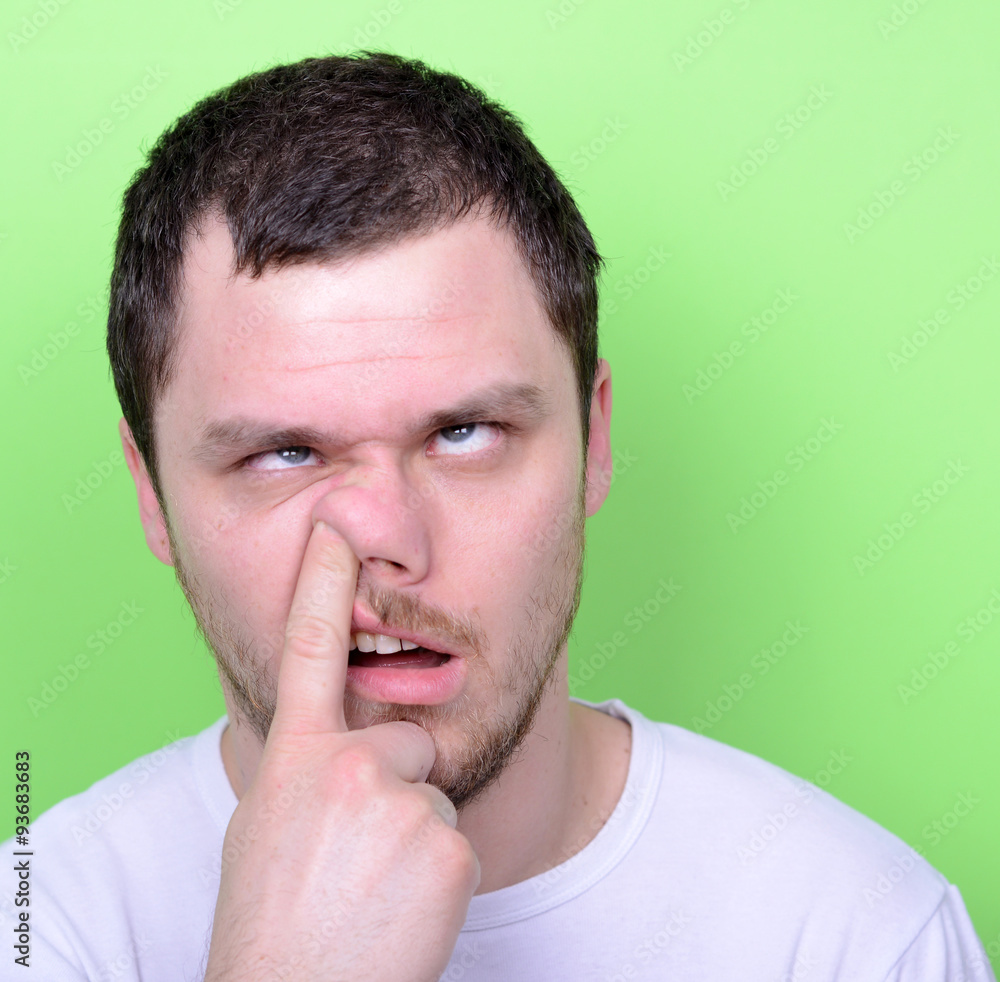Portrait of a funny guy with finger in his nose Stock Photo | Adobe Stock