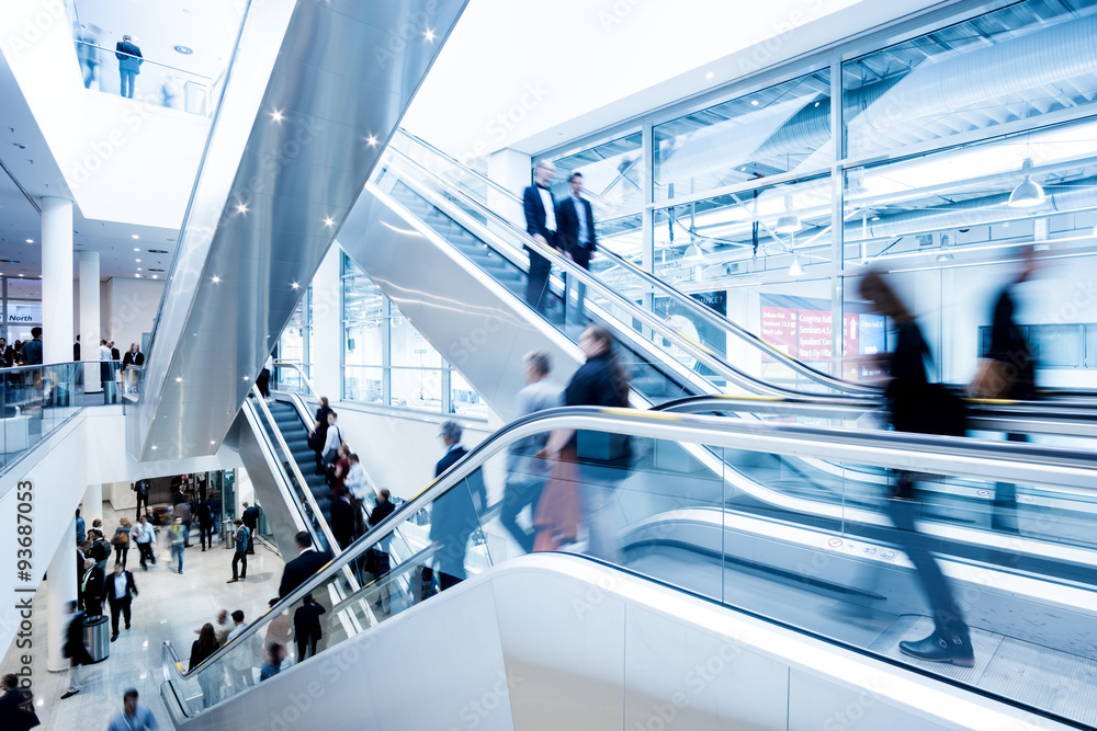 Fototapeta premium Blurred people using a skywalk/staircase