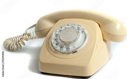 Retro yellow phone isolated on white background