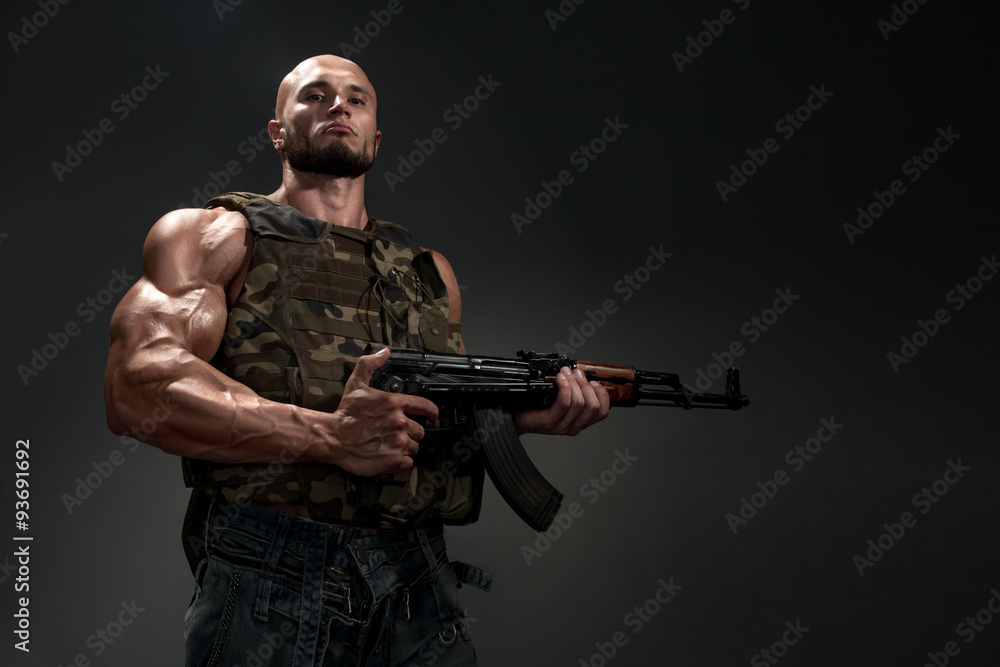 portrait of soldier with a gun on black background portrait of soldier with a gun on black background