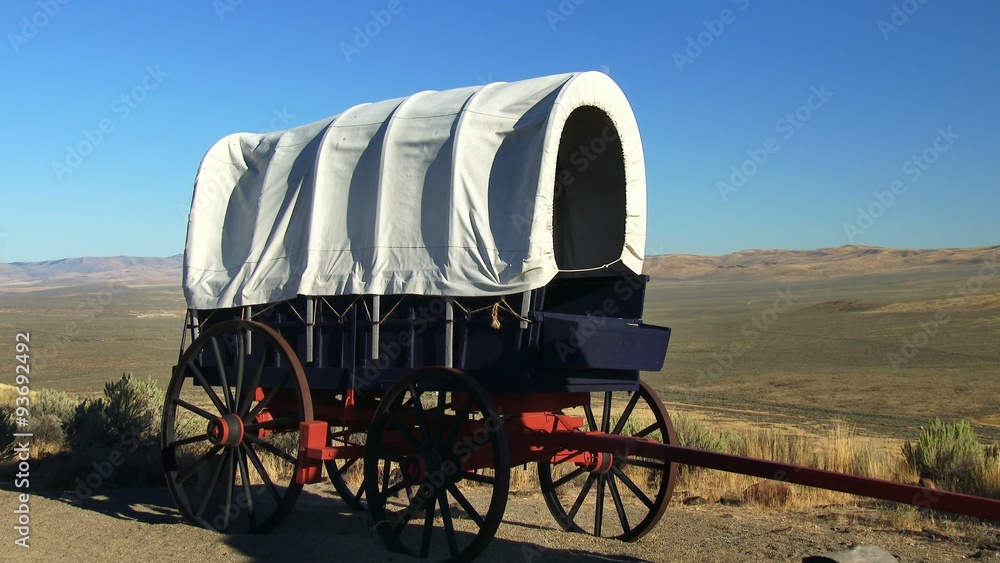 A covered wagon with the Oregon prairie in background, 4K Ultra HD A covered wagon with the Oregon prairie in background, 4K Ultra HD