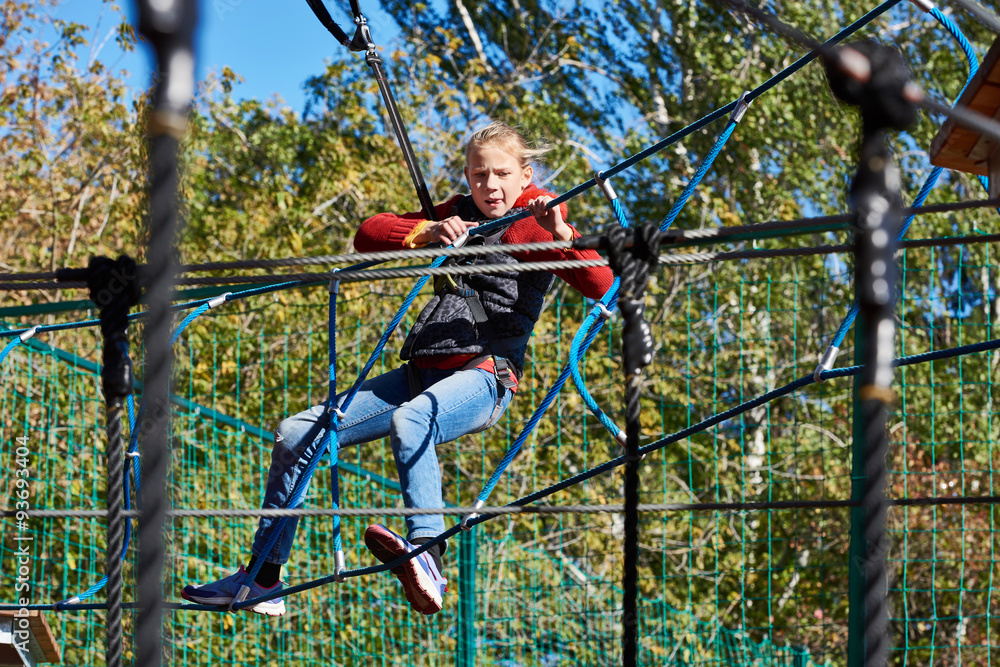 Girl is climbing to amusement park Girl is climbing to amusement park
