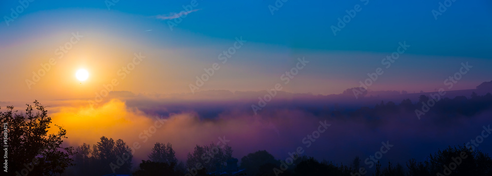 Autumn fog at misty fields, sunrise or sunset