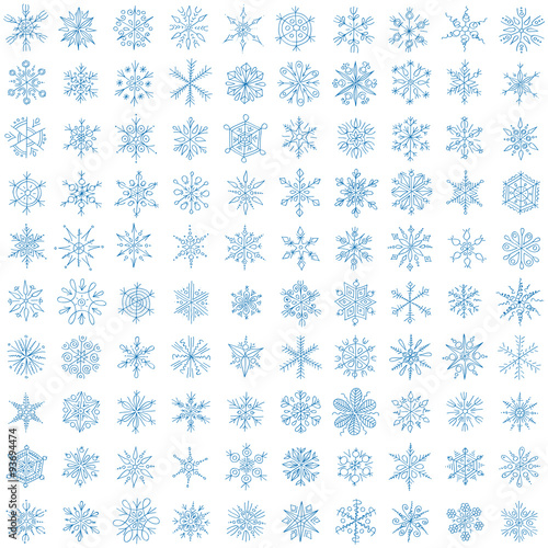 one hundred different blue snowflakes on a white background