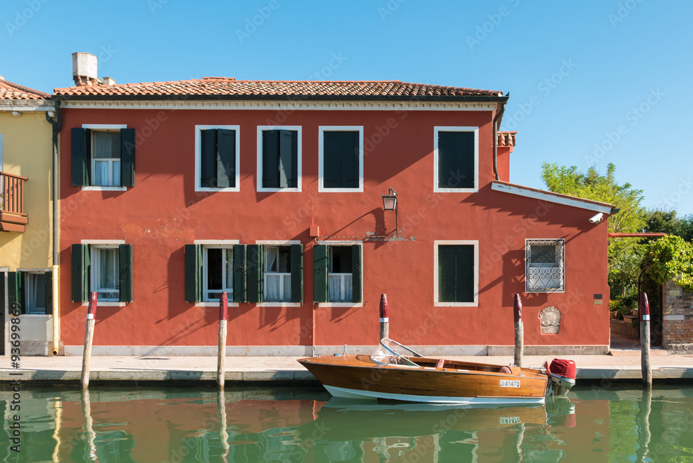 Typical Venetian house with boat used for transportation.