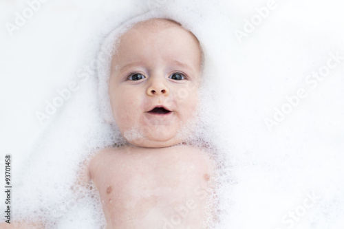 Toddler showing face just above water surface.