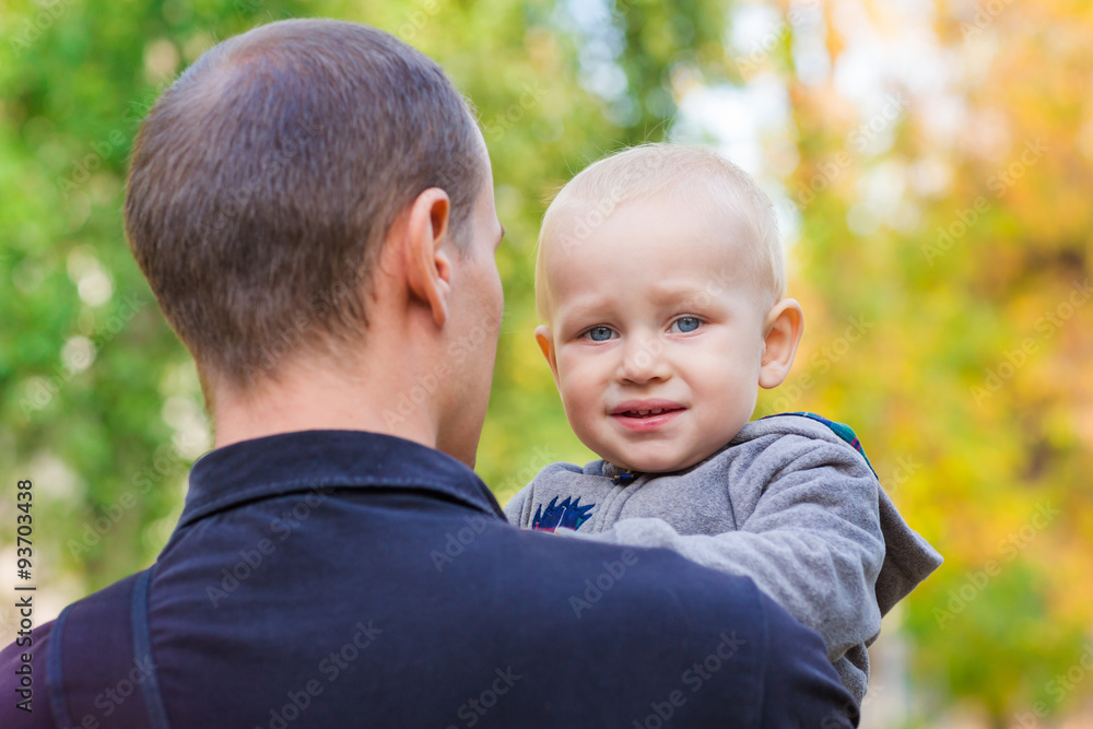 Happy father and his son outdoors. Child hugging daddy. Happy father and his son outdoors. Child hugging daddy.