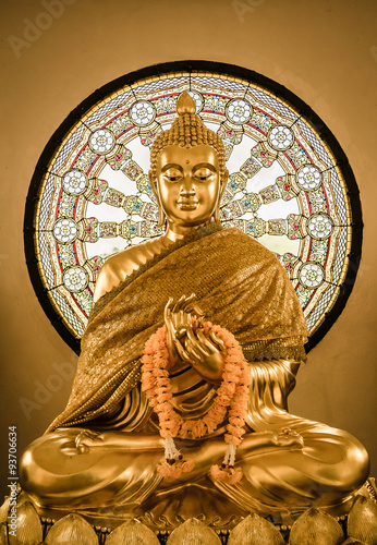 Buddha statue and Wheel of life photo