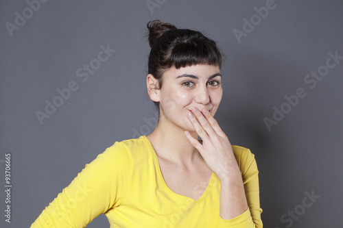 joyful young woman forgetting something or making a mistake photo