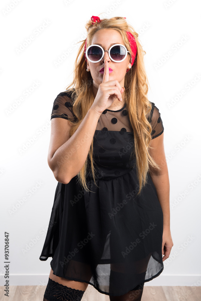 Pin-up girl making silence gesture Pin-up girl making silence gesture