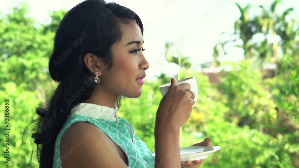 Young, beautiful woman drinking coffee on terrace, super slow motion 240fps
Young, beautiful woman drinking coffee on terrace, super slow motion 240fps