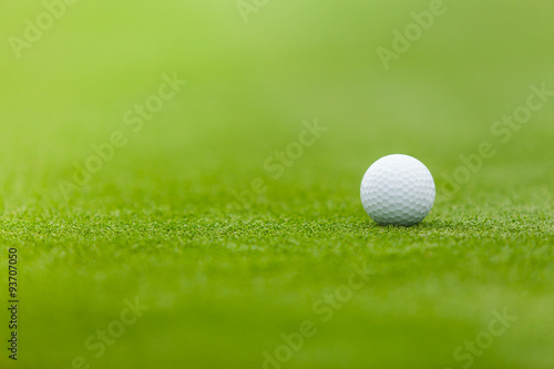 Golf ball on the green lawn