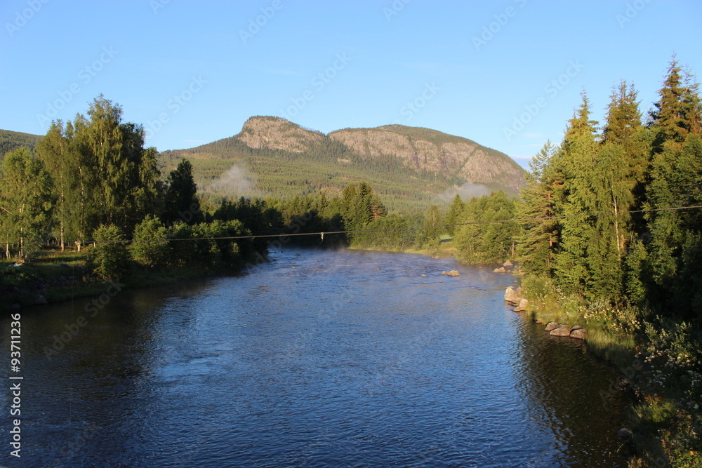 Peaceful landscape in the countryside of Norway, Europe, in early morning light. The river Ustaelva is located near Hallingskarvet National Park. Peaceful landscape in the countryside of Norway, Europe, in early morning light. The river Ustaelva is located near Hallingskarvet National Park.