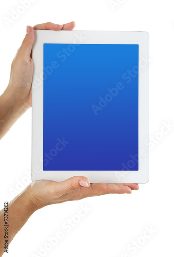Hands holding tablet PC with blue screen, isolated on white