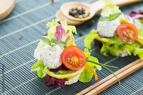 Healthy Rice Canape with Protein Cheese and Cherry Tomato, Sesame, Green Lettuce, Lemon, Purple Cabbage, Pepper