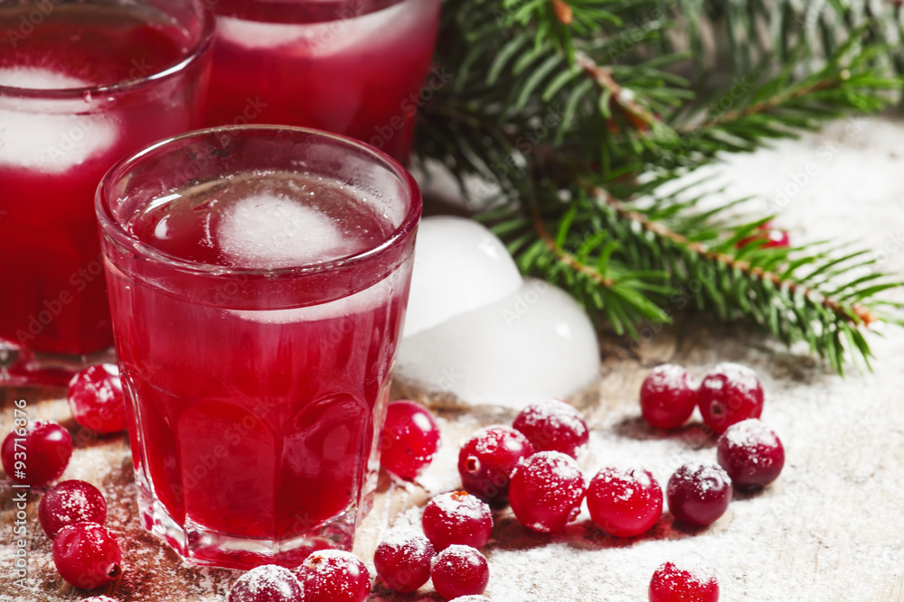 Christmas cranberry cocktail with ice, decorated with fir branch Christmas cranberry cocktail with ice, decorated with fir branch