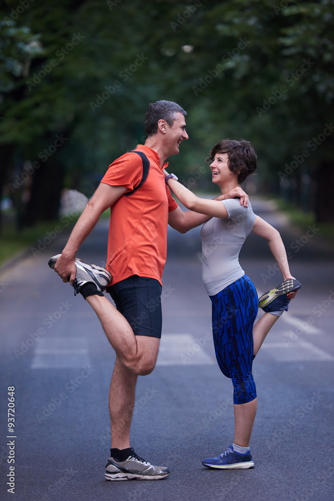 jogging couple stretching