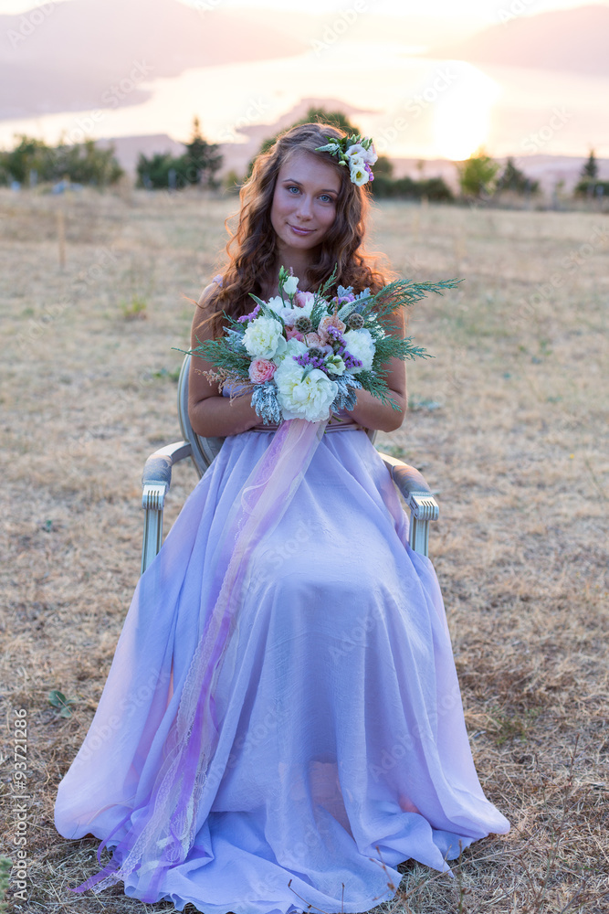 Fototapeta premium Attractive bride is holding a wedding bouquet