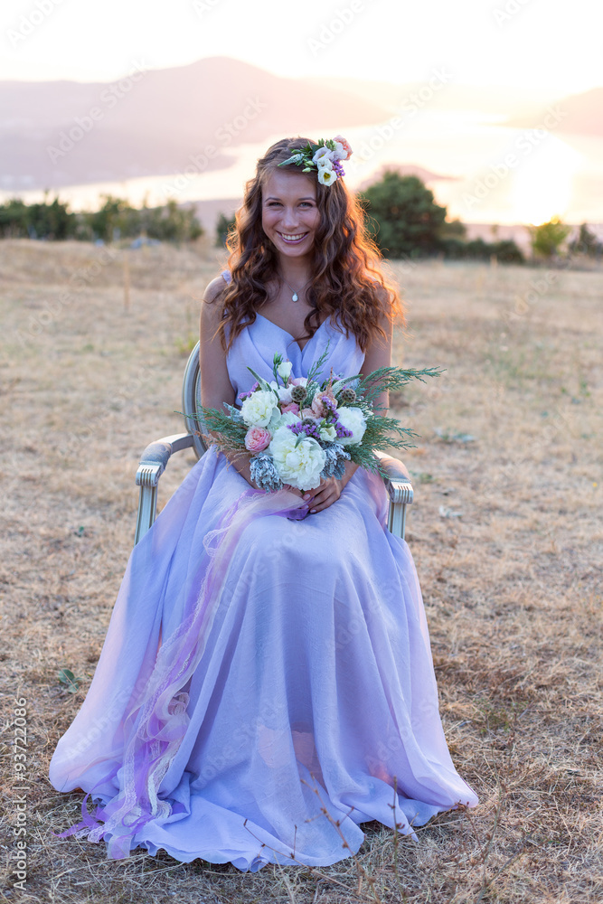 Fototapeta premium Attractive bride is holding a wedding bouquet
