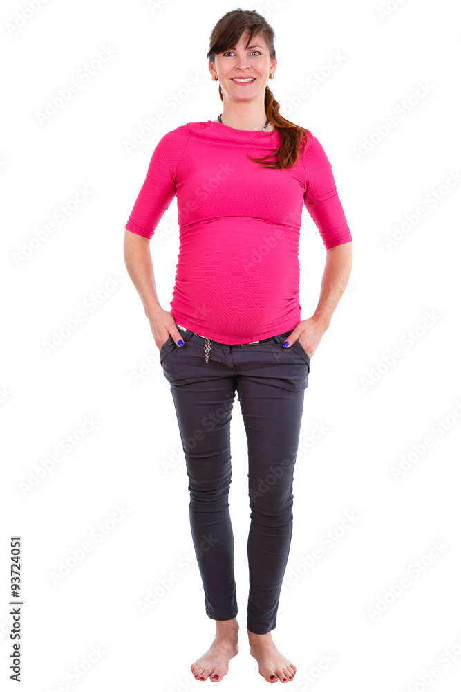 Happy and smiling pregnant woman nine months, portrait in full length. In tight pants and barefoot. On white isolated background, Positive human emotion, facial expression Happy and smiling pregnant woman nine months, portrait in full length. In tight pants and barefoot. On white isolated background, Positive human emotion, facial expression