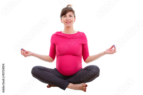 Relaxing pregnant woman nine months. Sitting in Turkish. On white isolated background, Positive human emotion