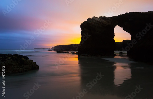 Natural arch at  cantabric coast  of Spain photo