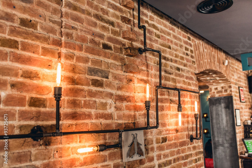 restaurant rustic walls, vintage interior design lamps, metal pipes and light bulbs