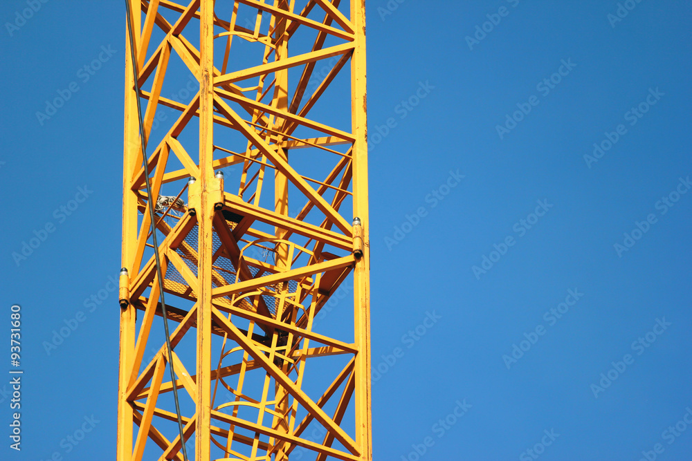 Fragment of building crane on blue sky background Fragment of building crane on blue sky background