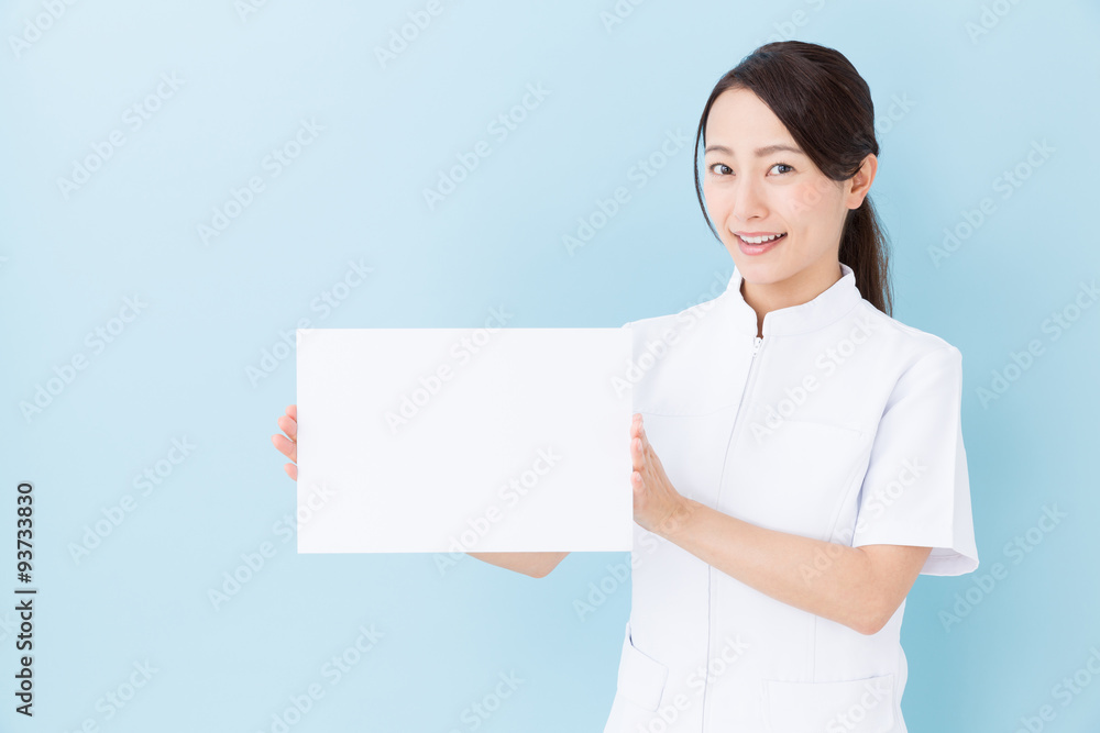 portrait of asian nurse on blue background portrait of asian nurse on blue background