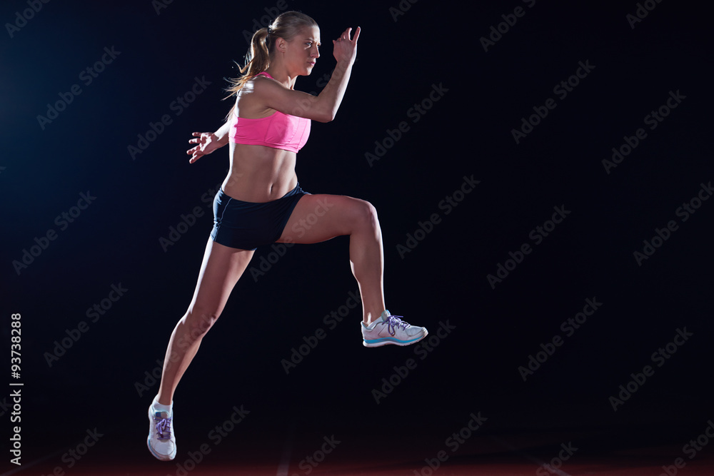 Athletic woman running on track Athletic woman running on track