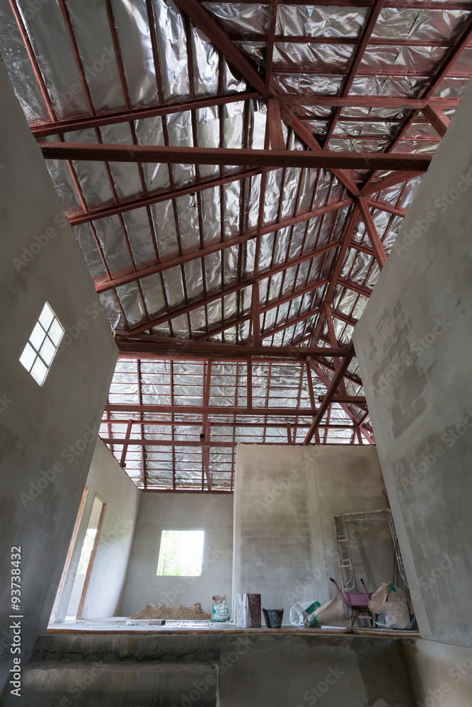 Obraz premium cement concrete wall and roof with steel beam and silver foil