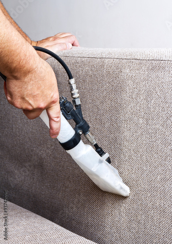 Professional cleaning of the upholstery on a sofa