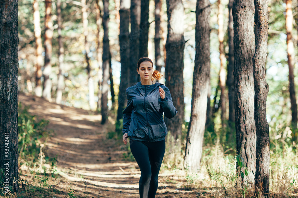  Runner woman jogging in autumn park