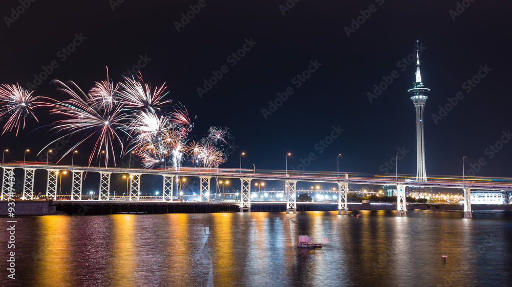 The old Macau-Taipa Bridge and Macau tower with fireworks