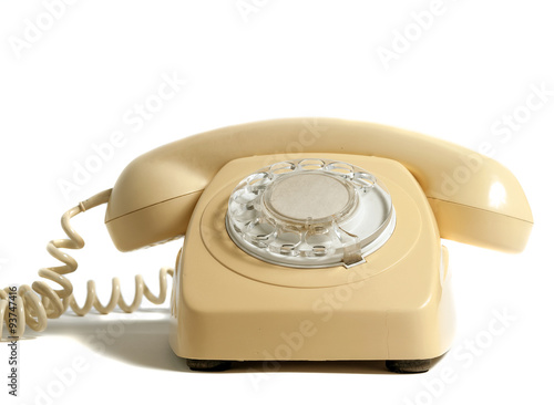 Retro yellow phone isolated on white background